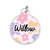 A round pet ID tag with pastel flower designs in pink, purple, and yellow, featuring the name "Willow" in black script on a white background.
