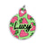 A round pet ID tag with a green background covered in pink strawberries and the name “Lucy” written in bold black script, attached to a silver keyring.